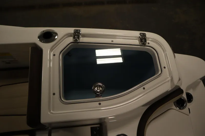 Slide: The Image of 2026 Yamaha Boats 252 FSH Sport livewell with secure latch and sleek design. - 35