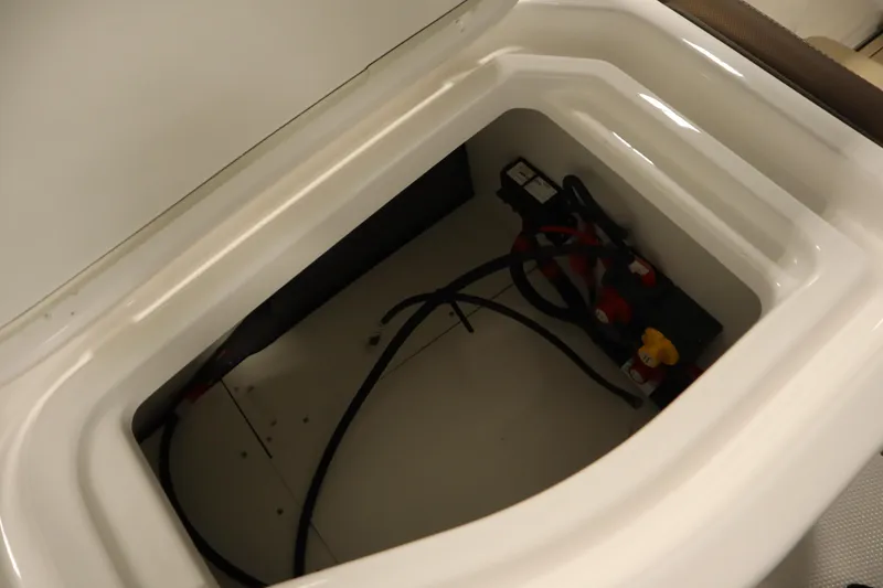 Slide: The Image of Battery compartment of 2026 Yamaha Boats 252 FSH Sport, showcasing internal wiring. - 37