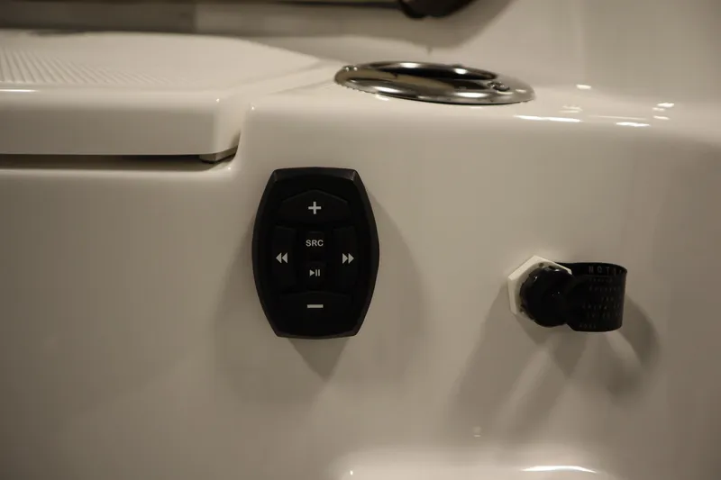 Slide: The Image of 2026 Yamaha Boats 252 FSH Sport audio control panel on white surface. - 41