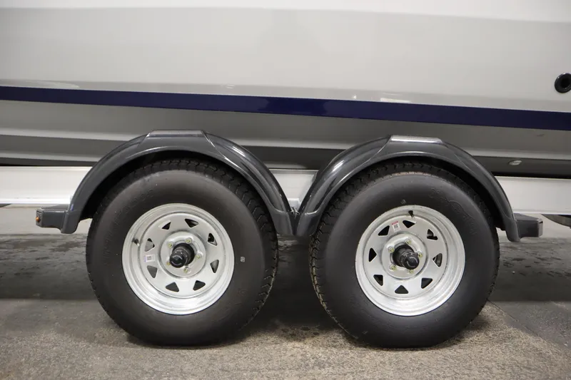 Slide: The Image of Trailer wheels of 2026 Yamaha Boats 252 FSH Sport, showcasing dual tire setup. - 45