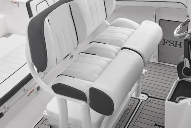 Slide: The Image of 2026 Yamaha Boats 252 FSH Sport interior seating, featuring sleek white and black upholstery. - 48