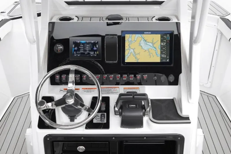 Slide: The Image of 2026 Yamaha Boats 252 FSH Sport dashboard with navigation screens and controls. - 51