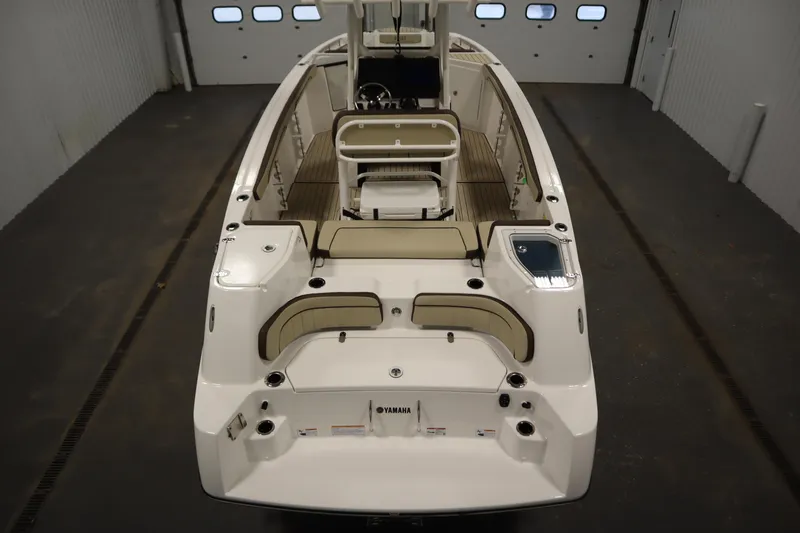 Slide: The Image of 2026 Yamaha Boats 252 FSH Sport, sleek design, spacious interior, modern features, indoor setting. - 9