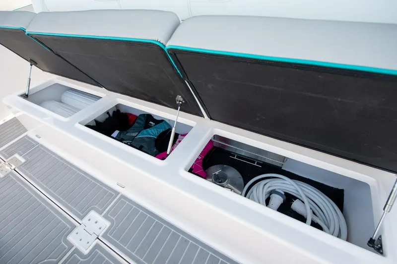 Slide: The Image of 2026 Regal 38 SAV boat storage compartments with gear and equipment. - 10