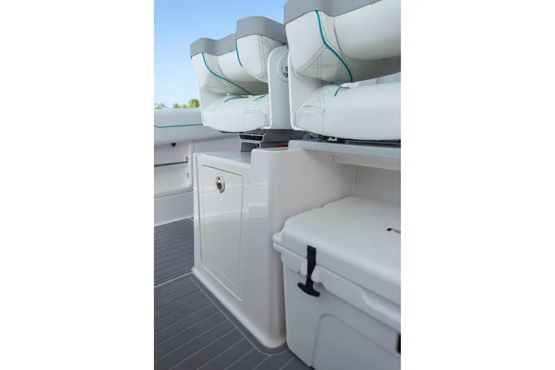 Slide: The Image of 2026 Regal 38 SAV boat interior with cushioned seating and storage compartments. - 19