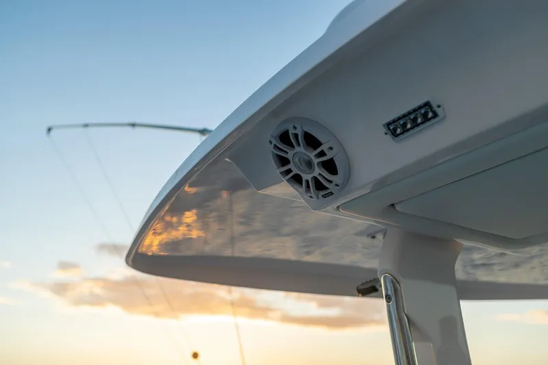Slide: The Image of Close-up of 2026 Regal 38 SAV boat's speaker and lighting at sunset. - 24