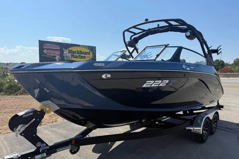 Slide: The Image of 2026 Yamaha Boats 222XE on trailer at BlackBeard Marine dealership. - 3