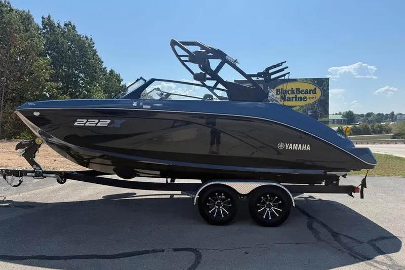 Slide: The Image of 2026 Yamaha Boats 222XE on trailer at BlackBeard Marine dealership. - 4