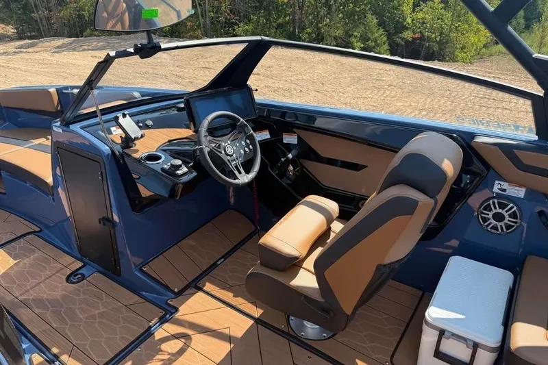 Slide: The Image of 2026 Yamaha Boats 222XE interior with modern dashboard and comfortable seating. - 8