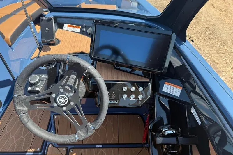 Slide: The Image of Yamaha Boats 2026 222XE dashboard with steering wheel and touchscreen display. - 9