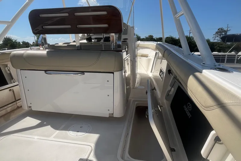 Slide: The Image of 2016 Pursuit S 280 Sport boat interior with seating and storage compartments. - 15