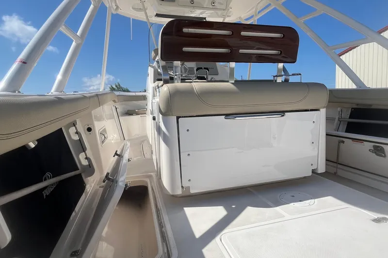 Slide: The Image of 2016 Pursuit S 280 Sport boat interior with seating and storage compartments. - 16