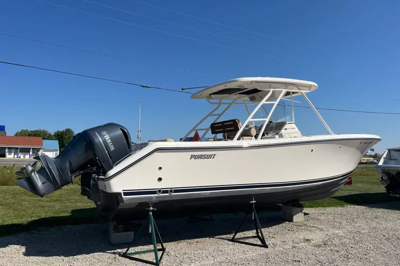 Slide: The Image of 2016 Pursuit S 280 Sport boat with Yamaha engine on display outdoors. - 2