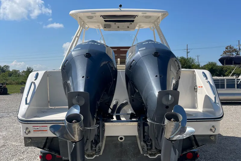 Slide: The Image of 2016 Pursuit S 280 Sport boat with dual outboard engines, rear view, sunny day. - 3