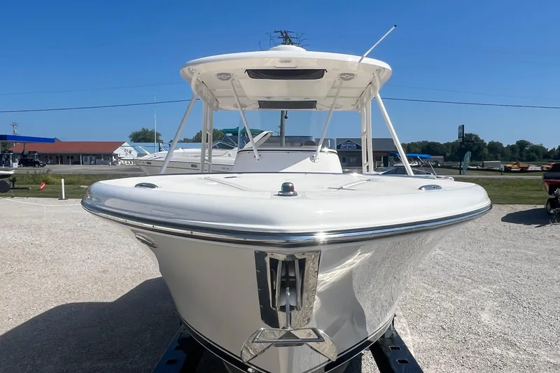 Slide: The Image of 2016 Pursuit S 280 Sport boat displayed outdoors on a sunny day. - 4