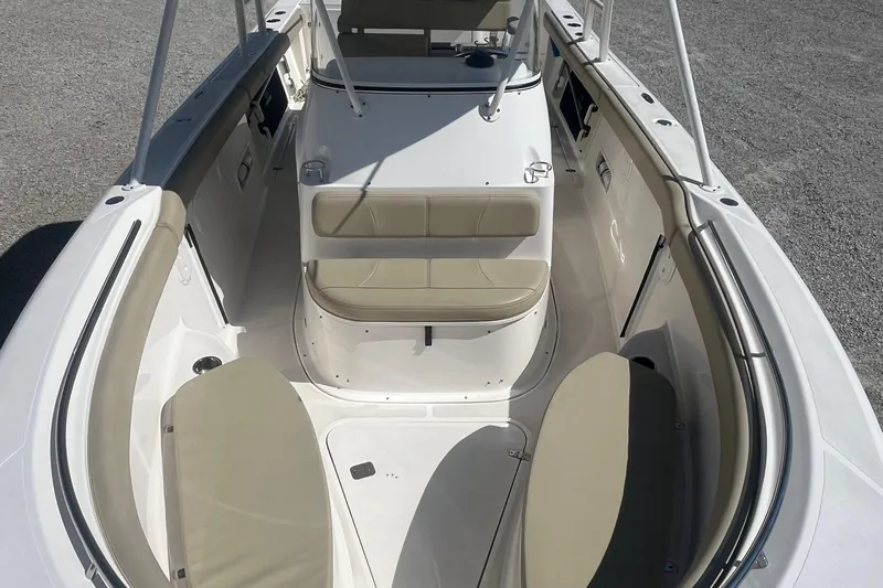 Slide: The Image of 2016 Pursuit S 280 Sport boat interior with cushioned seating and spacious deck. - 5