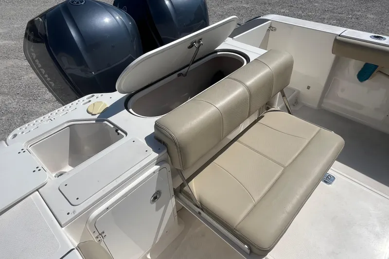 Slide: The Image of 2016 Pursuit S 280 Sport boat interior with seating and storage compartments. - 9