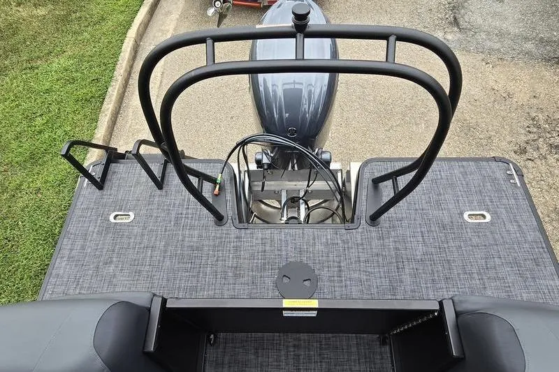 Slide: The Image of 2026 Godfrey SWEETWATER 2286 SB boat deck with motor and railing, top view. - 15