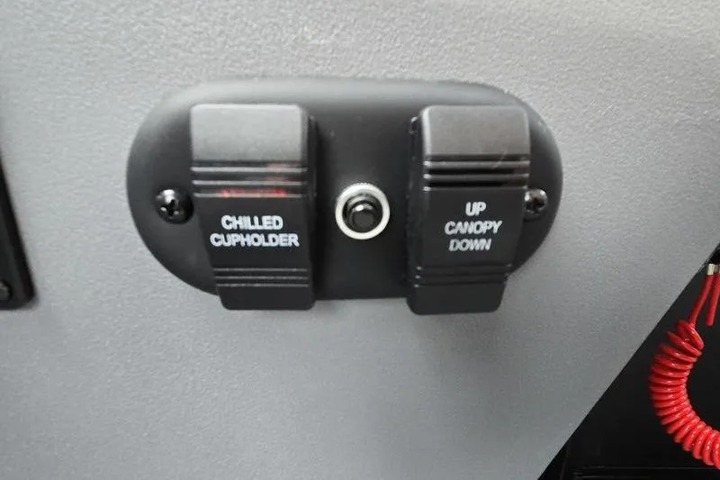 Slide: The Image of Control panel with chilled cupholder and canopy switches on 2026 Godfrey SWEETWATER 2286 SB. - 7