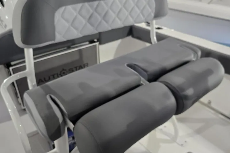 Slide: The Image of 2026 NauticStar 222 Offshore boat seat with gray cushioned design. - 11