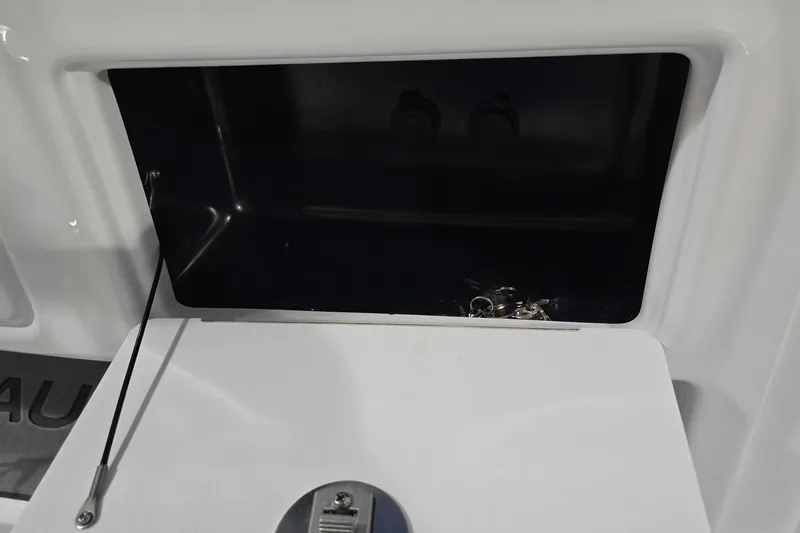 Slide: The Image of Storage compartment on 2026 NauticStar 222 Offshore boat, featuring a sleek design. - 14