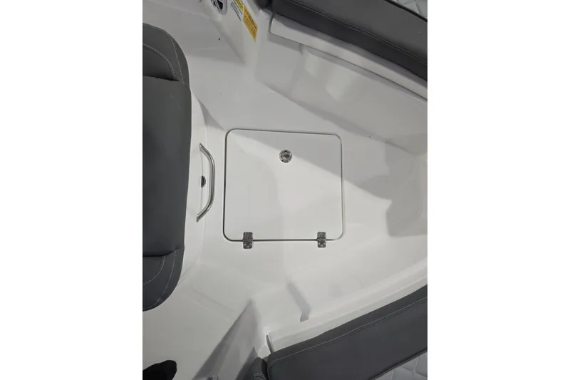 Slide: The Image of 2026 NauticStar 222 Offshore boat interior with storage compartment and seating. - 18