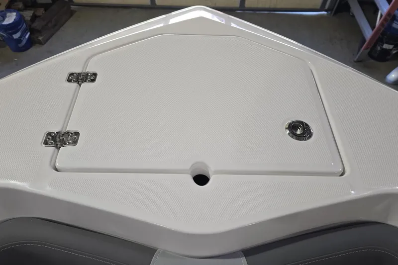 Slide: The Image of 2026 NauticStar 222 Offshore boat deck with storage hatch and stainless steel hardware. - 22