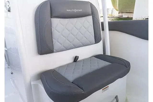 Slide: The Image of 2026 NauticStar 222 Offshore livewell with clear lid and stainless steel latch. - 6