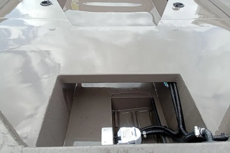 Slide: The Image of 2025 Alweld 1548 Invader boat on trailer outside First Mates building. - 14