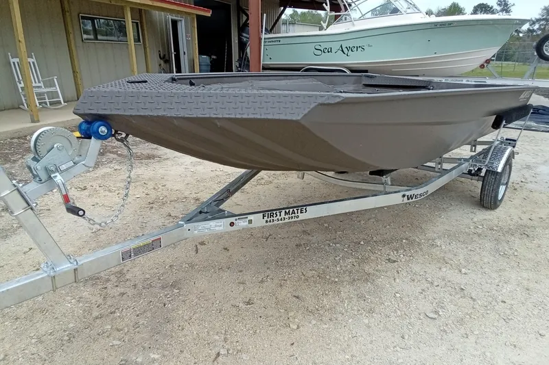 Slide: The Image of 2025 Alweld 1548 Invader boat on trailer in outdoor dealership lot. - 5