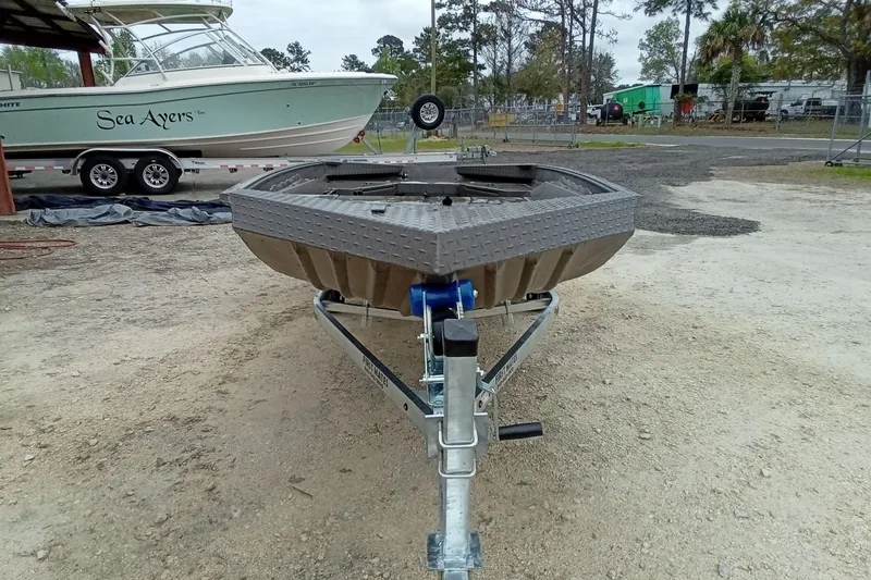 Slide: The Image of 2025 Alweld 1548 Invader boat in a parking lot with other boats. - 6