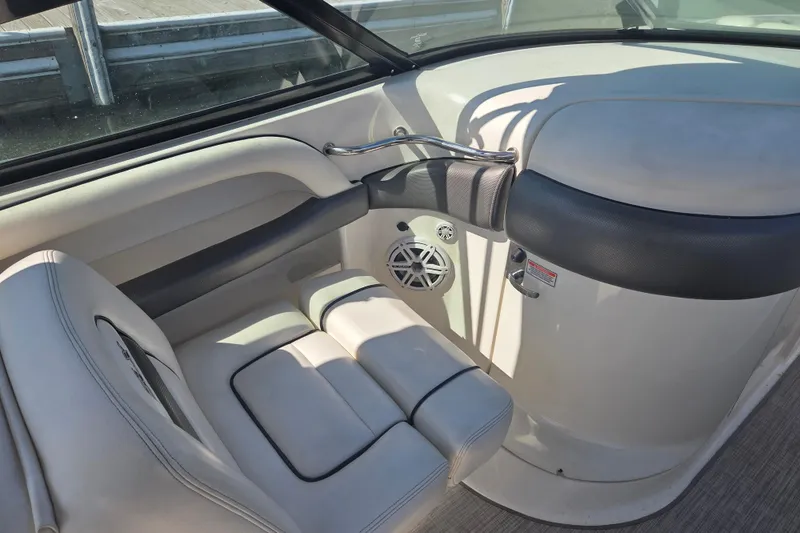 Slide: The Image of Interior of 2006 Sea Ray 290 Select EX boat, featuring white seating and speaker. - 19