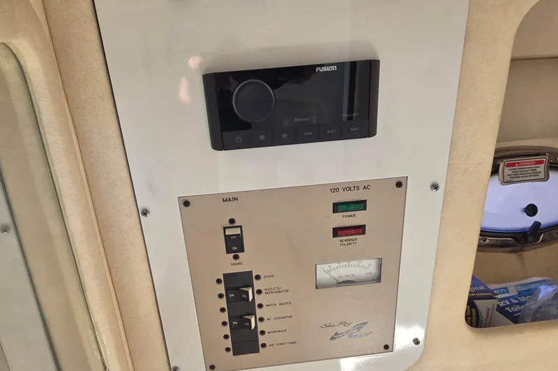 Slide: The Image of Control panel of a 2006 Sea Ray 290 Select EX boat with Fusion audio system. - 21