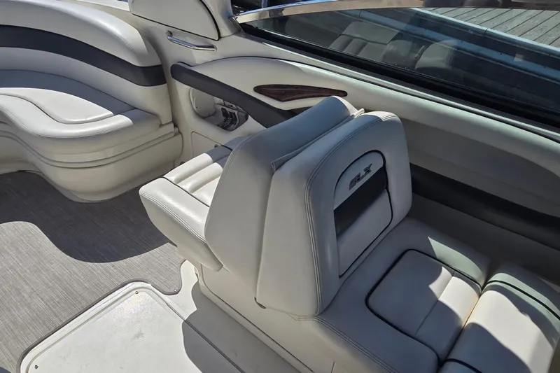 Slide: The Image of Interior of 2006 Sea Ray 290 Select EX boat with white leather seating. - 24