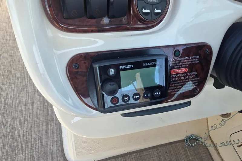 Slide: The Image of Control panel of a 2006 Sea Ray 290 Select EX boat with Fusion MS-NRX300 stereo. - 32