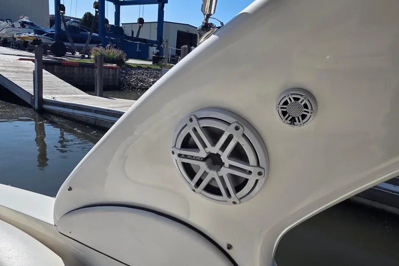 Slide: The Image of 2006 Sea Ray 290 Select EX boat speakers near dockside. - 38