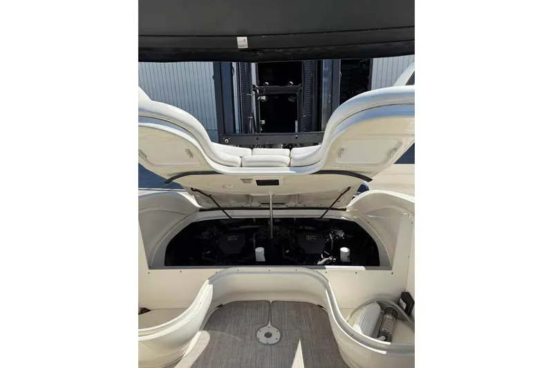 Slide: The Image of 2006 Sea Ray 290 Select EX boat engine compartment with open hatch, showcasing interior details. - 7