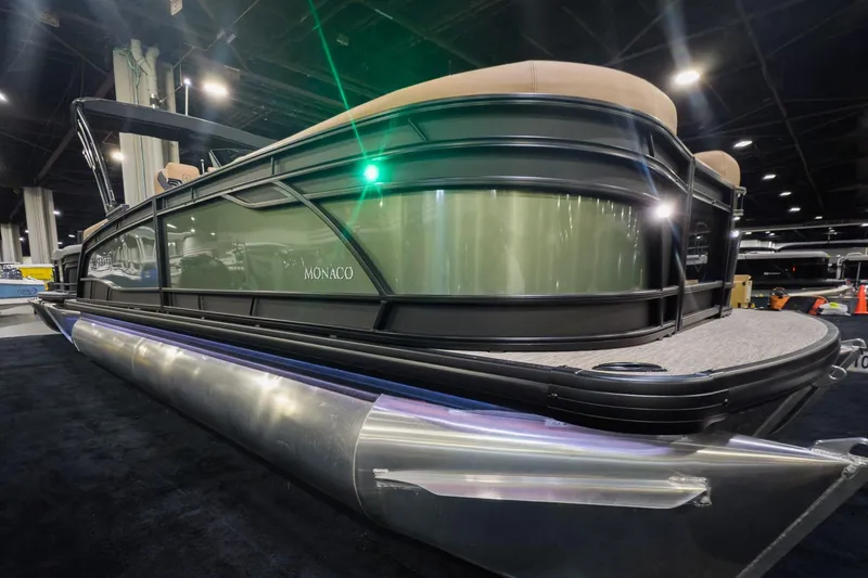 The Image of 2026 Godfrey Monaco 235 Split Bench pontoon boat displayed indoors. - 0