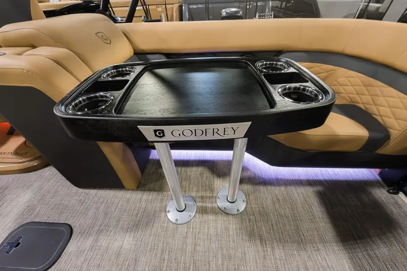 Slide: The Image of 2026 Godfrey Monaco 235 Split Bench with sleek table and cup holders. - 14