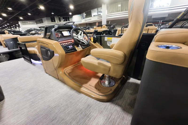 Slide: The Image of 2026 Godfrey Monaco 235 Split Bench boat interior with modern helm and luxurious seating. - 16