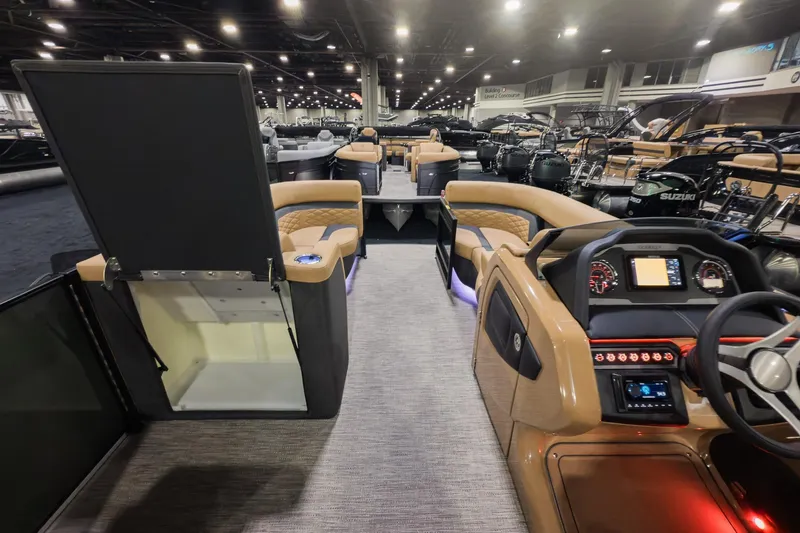 Slide: The Image of Interior view of 2026 Godfrey Monaco 235 Split Bench boat, featuring modern dashboard and seating. - 17