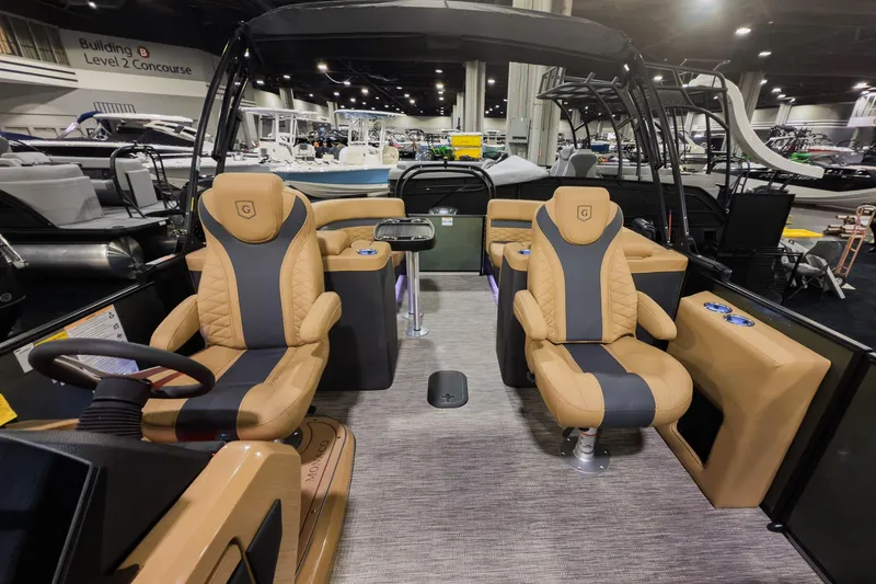 Slide: The Image of Luxurious interior of 2026 Godfrey Monaco 235 Split Bench pontoon boat at a showroom. - 6