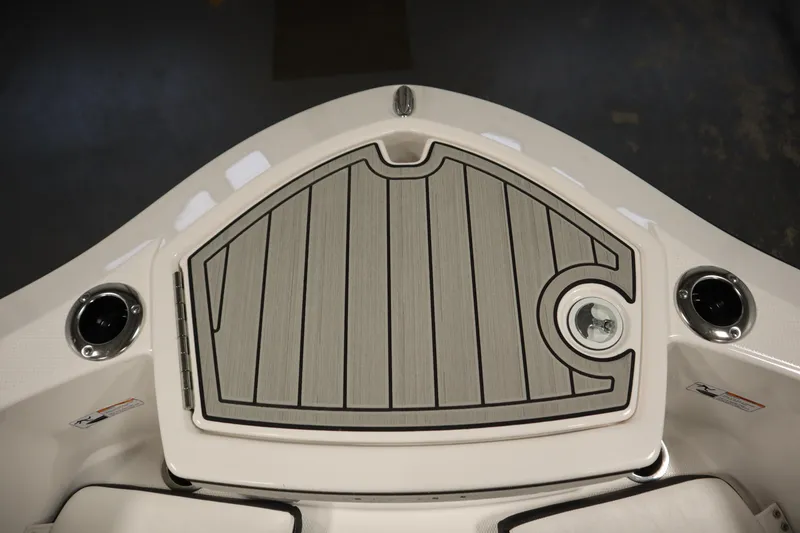 Slide: The Image of 2026 Yamaha Boats 255 FSH Sport E bow deck with sleek design and cup holders. - 11