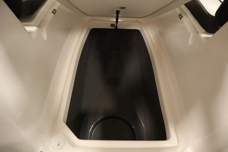 Slide: The Image of 2026 Yamaha Boats 255 FSH Sport E storage compartment, featuring sleek design and spacious interior. - 17