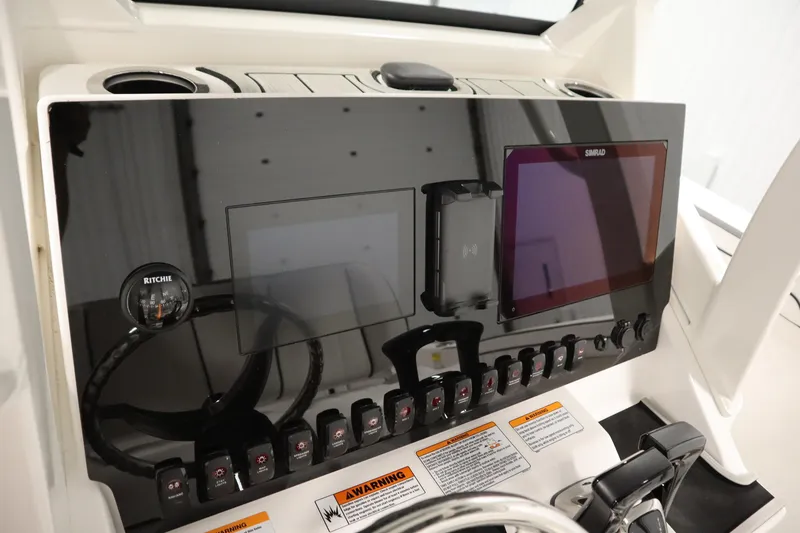 Slide: The Image of Dashboard of 2026 Yamaha Boats 255 FSH Sport E with modern controls and displays. - 28