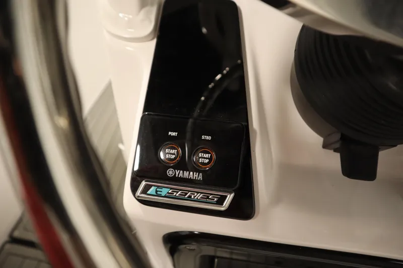 Slide: The Image of Yamaha Boats 2026 255 FSH Sport E dashboard with start-stop buttons. - 32
