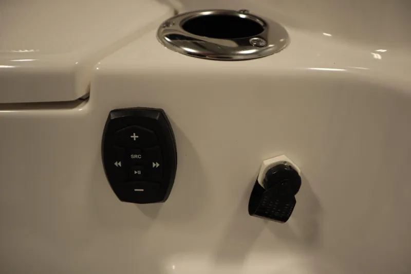 Slide: The Image of Control panel on 2026 Yamaha Boats 255 FSH Sport E, featuring audio and accessory controls. - 50