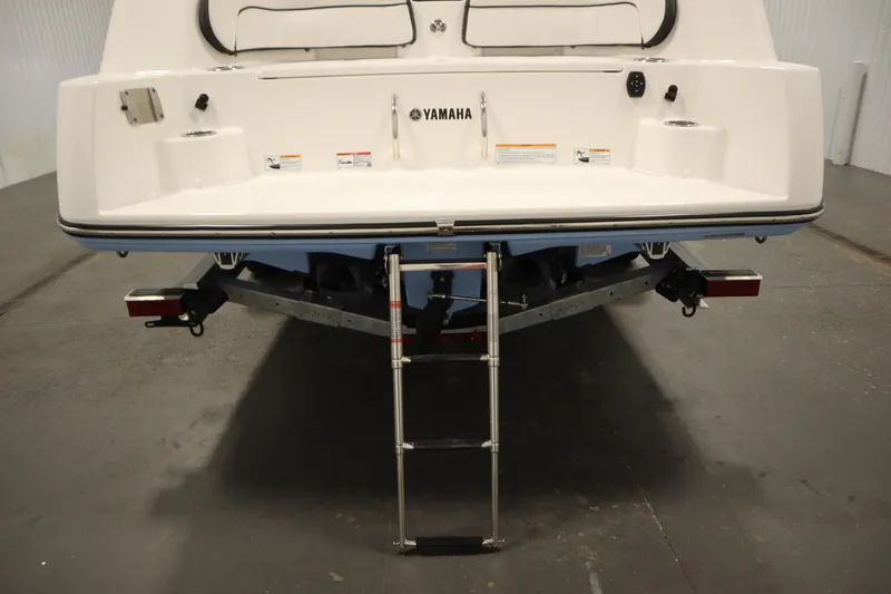 Slide: The Image of 2026 Yamaha Boats 255 FSH Sport E, rear view with swim platform and ladder. - 51