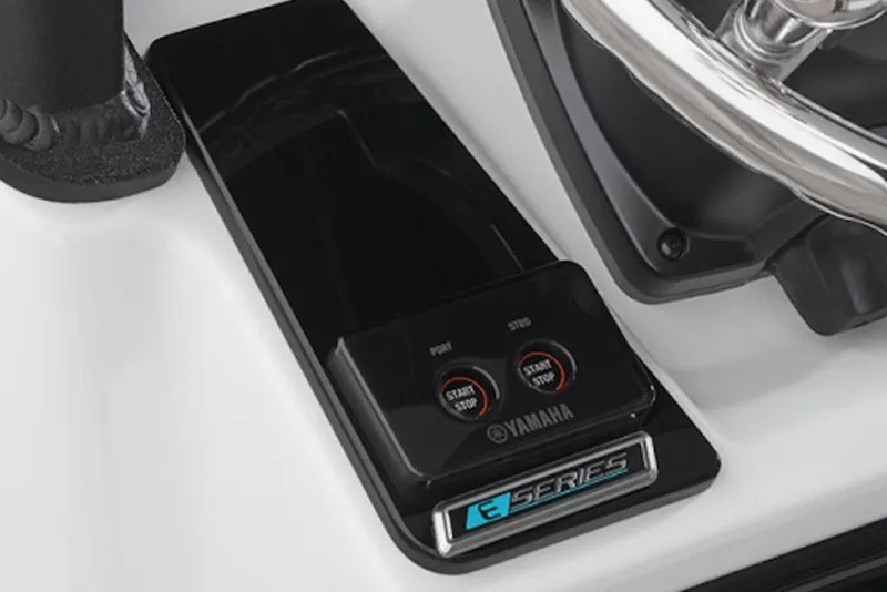 Slide: The Image of 2026 Yamaha Boats 255 FSH Sport E dashboard with start/stop controls and steering wheel. - 59