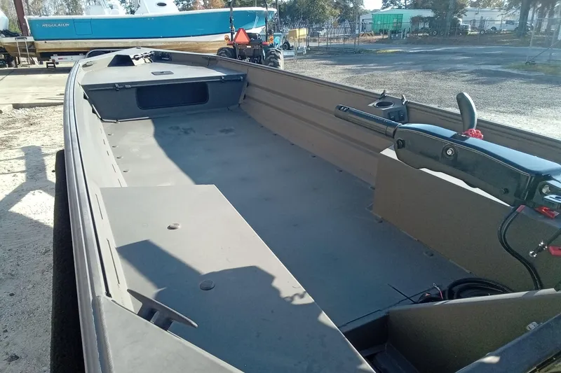 Slide: The Image of 2025 Alweld 1648VV Marsh boat interior, showcasing spacious layout and controls. - 12